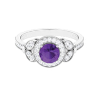 Vintage-style amethyst and diamond halo engagement ring by Rosec Jewels, featuring intricate detailing and a central purple gemstone.