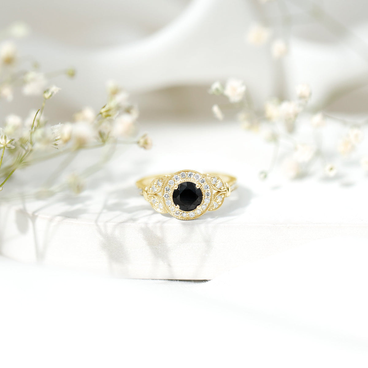 Vintage-looking Rosec Jewels 1.3 Carat lab-grown black diamond engagement ring with white diamond accents, elegant and unique design.