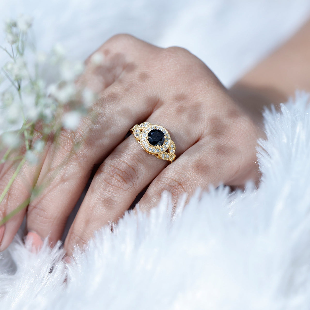Vintage-style 1.3 carat lab-grown black diamond engagement ring with white diamonds, featuring intricate detailing and rose gold accents.