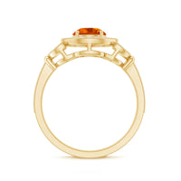 Vintage-inspired Fire Opal engagement ring with diamond accents, featuring a central fiery orange opal and intricate band design.