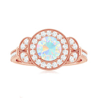 Vintage Ethiopian Rainbow Opal engagement ring with diamond halo, featuring intricate design and sparkling accents by Rosec Jewels.