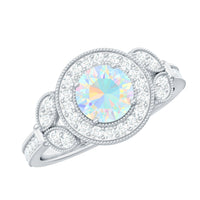 Vintage Ethiopian Rainbow Opal engagement ring with diamond halo from Rosec Jewels featuring colorful rainbow opal and sparkling diamond accents.