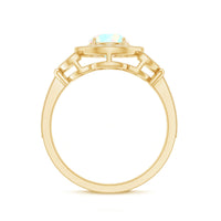 Vintage Ethiopian Rainbow Opal engagement ring with diamond halo from Rosec Jewels, showcasing colorful rainbow opal and sparkling diamonds.