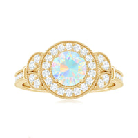 Vintage-inspired Ethiopian rainbow opal engagement ring with diamond halo, showcasing vibrant colors and intricate design from Rosec Jewels.