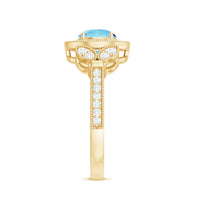 Vintage-inspired aquamarine engagement ring with diamond halo from Rosec Jewels, featuring a detailed silver band and elegant design.
