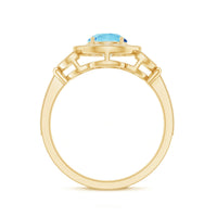 Vintage-inspired Rosec Jewels aquamarine engagement ring with diamond halo, showcasing a central aquamarine stone and intricate band detail.