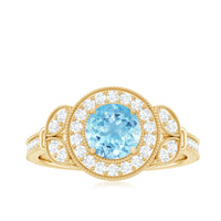 Vintage-inspired real aquamarine engagement ring with diamond halo, Rosec Jewels, showcasing intricate design and sparkling gemstones.