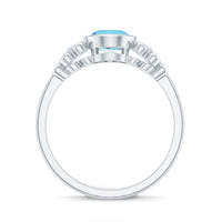 Natural 1 Carat oval aquamarine engagement ring with diamond accents by Rosec Jewels, featuring a delicate gold band and elegant design.