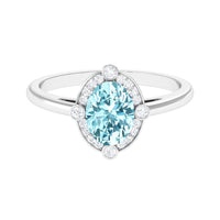 Oval 1 Carat aquamarine halo engagement ring with diamond accents, showcasing Rosec Jewels' elegant ring design.