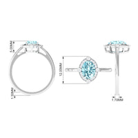 Oval 1 Carat aquamarine engagement ring with diamond halo by Rosec Jewels, showcasing the ring's detailed design and sparkling stones.
