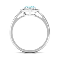 Oval 1 Carat Aquamarine engagement ring with diamond halo by Rosec Jewels, featuring a silver band and detailed craftsmanship