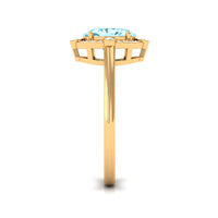 Oval aquamarine engagement ring with halo of diamonds from Rosec Jewels, featuring a 1-carat center stone and intricate band details.