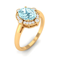 Oval 1 Carat Aquamarine engagement ring with diamond halo, featuring rose gold band and intricate detailing by Rosec Jewels.