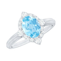 Oval engagement ring with a 1-carat aquamarine centerpiece, accented by diamonds, from Rosec Jewels.