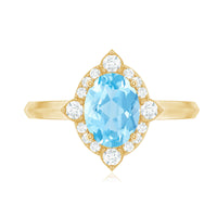 Oval engagement ring by Rosec Jewels featuring a 1-carat aquamarine gemstone surrounded by diamonds.