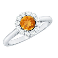 Natural citrine promise ring with diamond halo from Rosec Jewels, showcasing a gold band and sparkling gemstone setting.