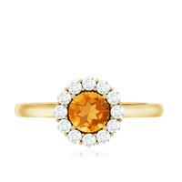 Natural citrine promise ring with diamond halo from Rosec Jewels, showcasing a gold band and sparkling gemstone setting.