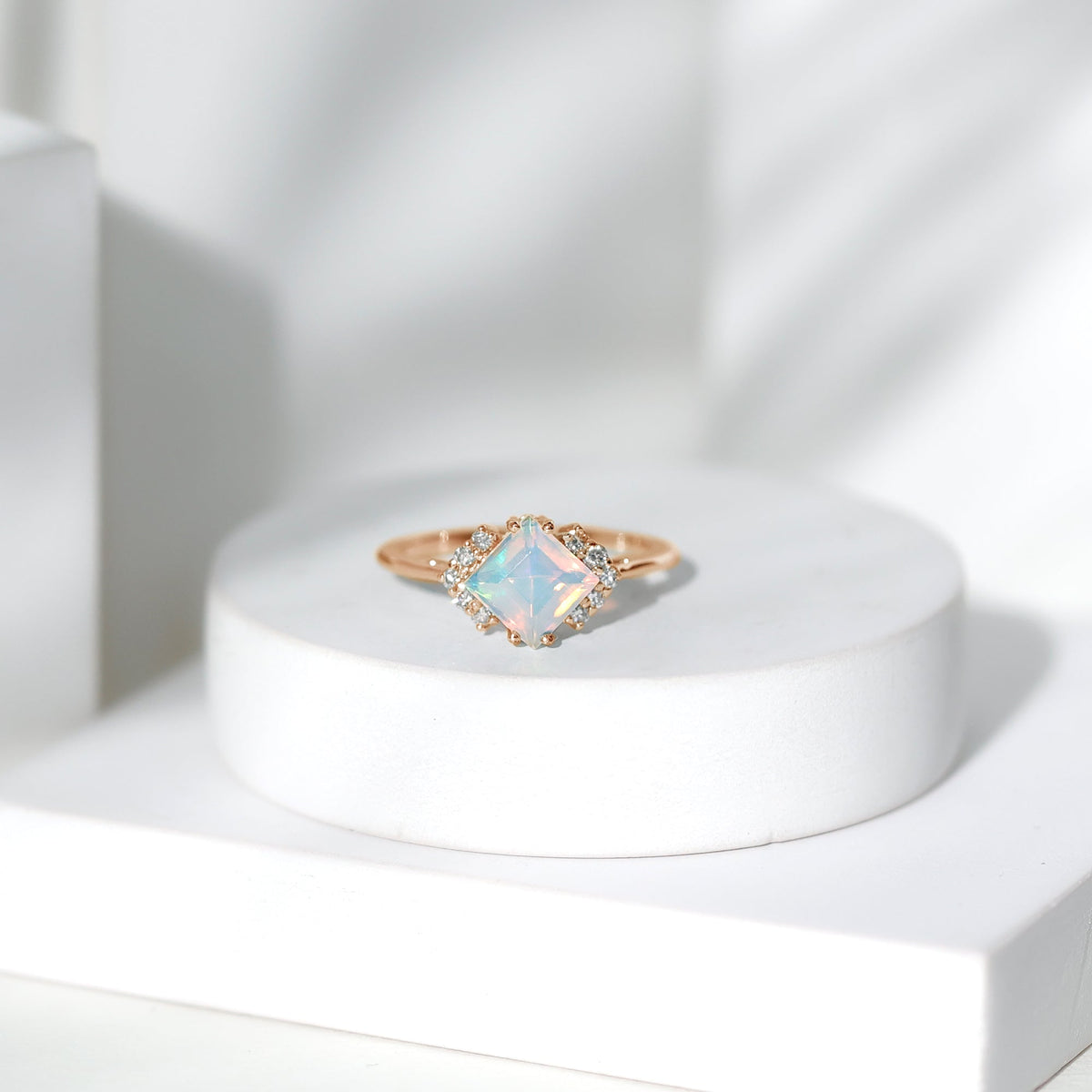 Natural Ethiopian opal princess cut engagement ring with diamond accent, showcasing a stunning gemstone setting and intricate band design.
