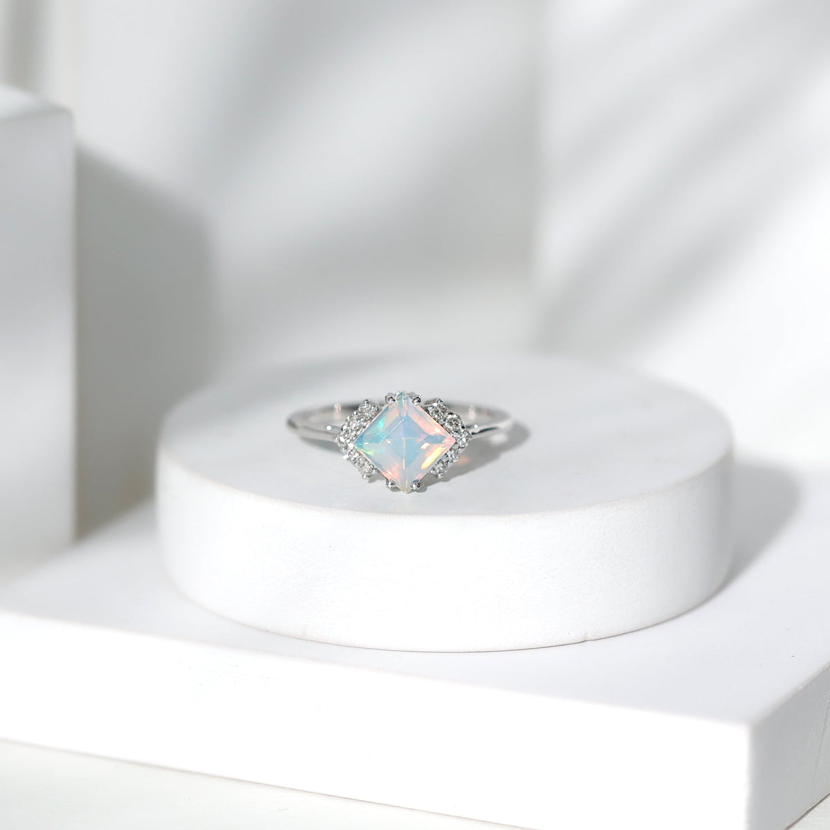 Natural Ethiopian Opal princess cut engagement ring with diamond accents, featuring a Rosec Jewels design and elegant gold band.