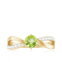 Natural 0.5 carat peridot infinity promise ring with diamond accents, showcasing a delicate gold band and sparkling gemstones.