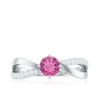 Rosec Jewels pink tourmaline and diamond infinity ring with a 1/2 carat solitaire, showcasing elegant design and sparkling gemstones.
