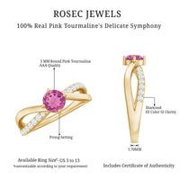 Pink tourmaline and diamond infinity ring from Rosec Jewels, featuring a 1/2 carat solitaire pink tourmaline set in a delicate band.