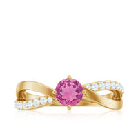 Pink tourmaline solitaire and diamond infinity ring from Rosec Jewels, showcasing a delicate band with vibrant pink gemstone and sparkling diamonds.