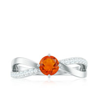 Rosec Jewels 1/2 CT fire opal solitaire and diamond infinity ring, featuring a vibrant fire opal center stone and intricate band design.