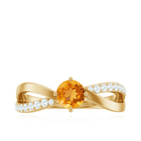 Certified real citrine engagement ring with diamond criss-cross shank, featuring a central yellow gemstone and intricate band design.