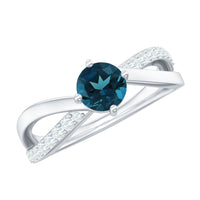 Rosec Jewels London Blue Topaz proposal ring with diamond, featuring a large blue topaz gemstone and sparkling accent diamonds.