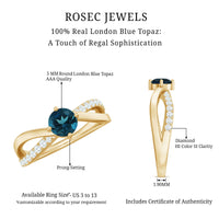 Rosec Jewels London Blue Topaz proposal ring with diamond accents, featuring a vibrant blue gemstone and elegant band detail.
