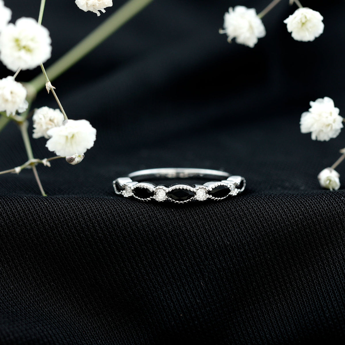Natural marquise cut black onyx half eternity ring by Rosec Jewels, featuring a continuous row of marquise-shaped black onyx stones.