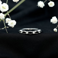 Natural marquise cut black onyx half eternity ring by Rosec Jewels, featuring a continuous row of marquise-shaped black onyx stones.