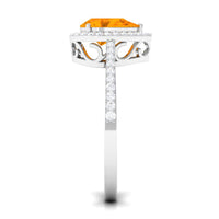 Real 0.6 carat fire opal teardrop engagement ring with diamond halo, featuring a rose gold band and intricate detailing.