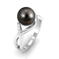 Tahitian pearl and diamond infinity crossover engagement ring by Rosec Jewels, featuring a pearl centerpiece and intricate band design.