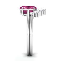 Oval pink tourmaline and diamond wedding ring set by Rosec Jewels, featuring a 1-carat gemstone with sparkling accents.