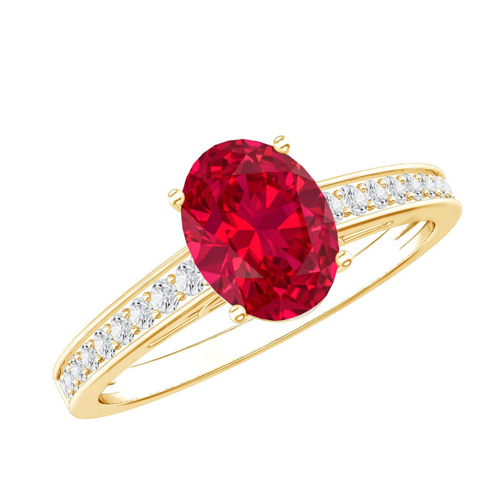 Oval lab-grown ruby engagement ring with diamond side stones, set in a elegant ring from Rosec Jewels.