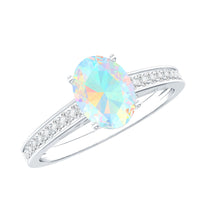 Natural 1.2 carat Ethiopian opal oval engagement ring with diamond side stones, featuring a rose gold band and intricate detailing.
