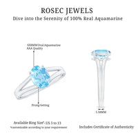 Genuine oval aquamarine solitaire engagement ring with split shank design from Rosec Jewels, showcasing the central gemstone and elegant band.