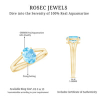 Genuine oval aquamarine solitaire engagement ring with split shank design from Rosec Jewels, showcasing the elegant gemstone setting.