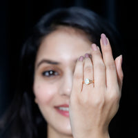 Oval Ethiopian rainbow opal engagement ring with split shank design by Rosec Jewels, showcasing vibrant gemstone and elegant craftsmanship.