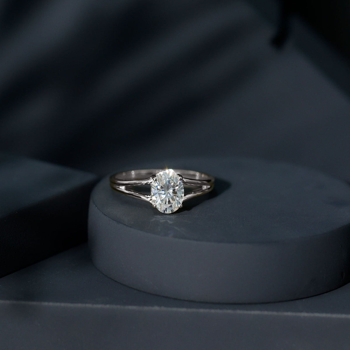Oval 1 Carat Moissanite engagement ring by Rosec Jewels featuring a sparkling gemstone and elegant band with certificate.