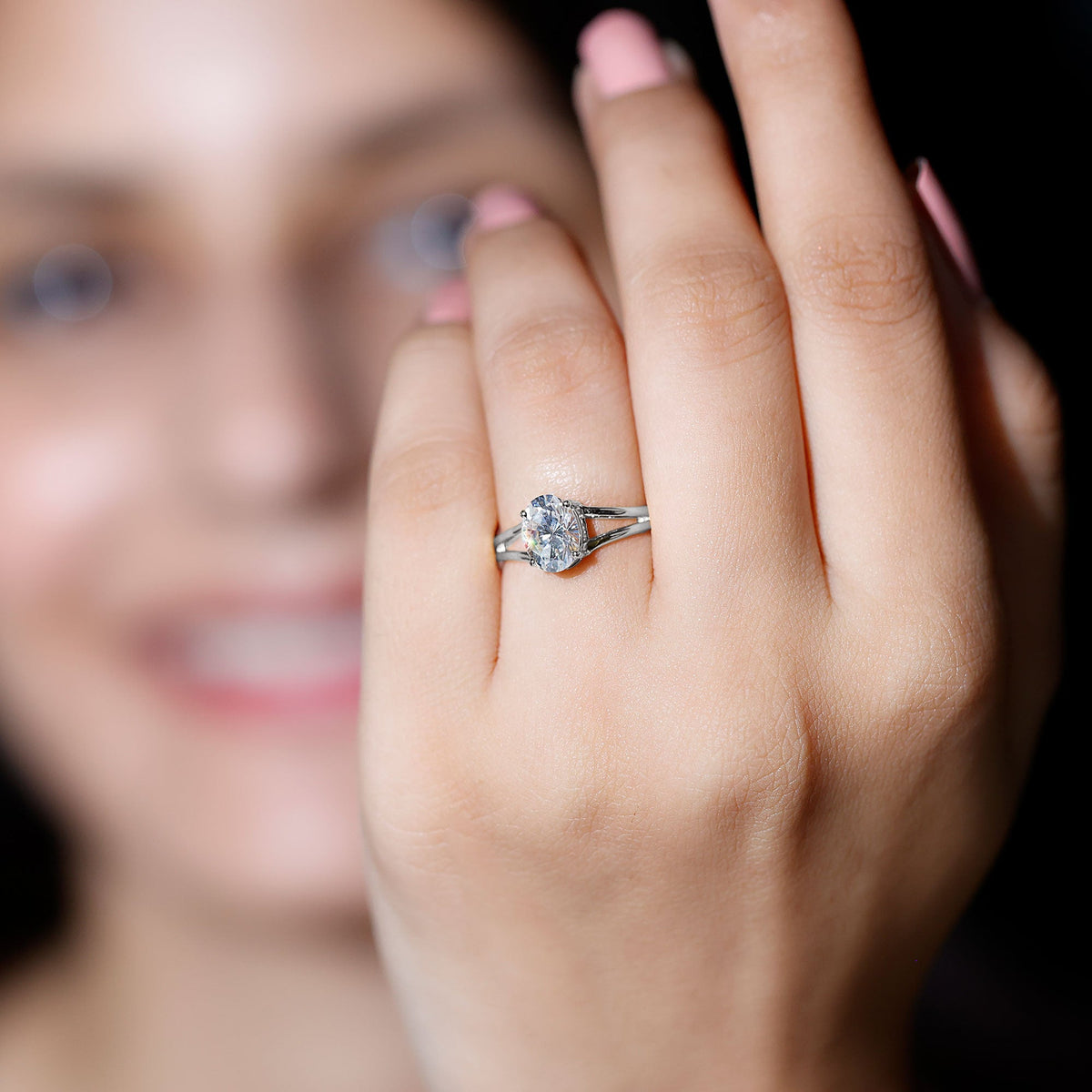 Oval 1-carat moissanite engagement ring by Rosec Jewels with certificate, featuring a sparkling gemstone and elegant band design.