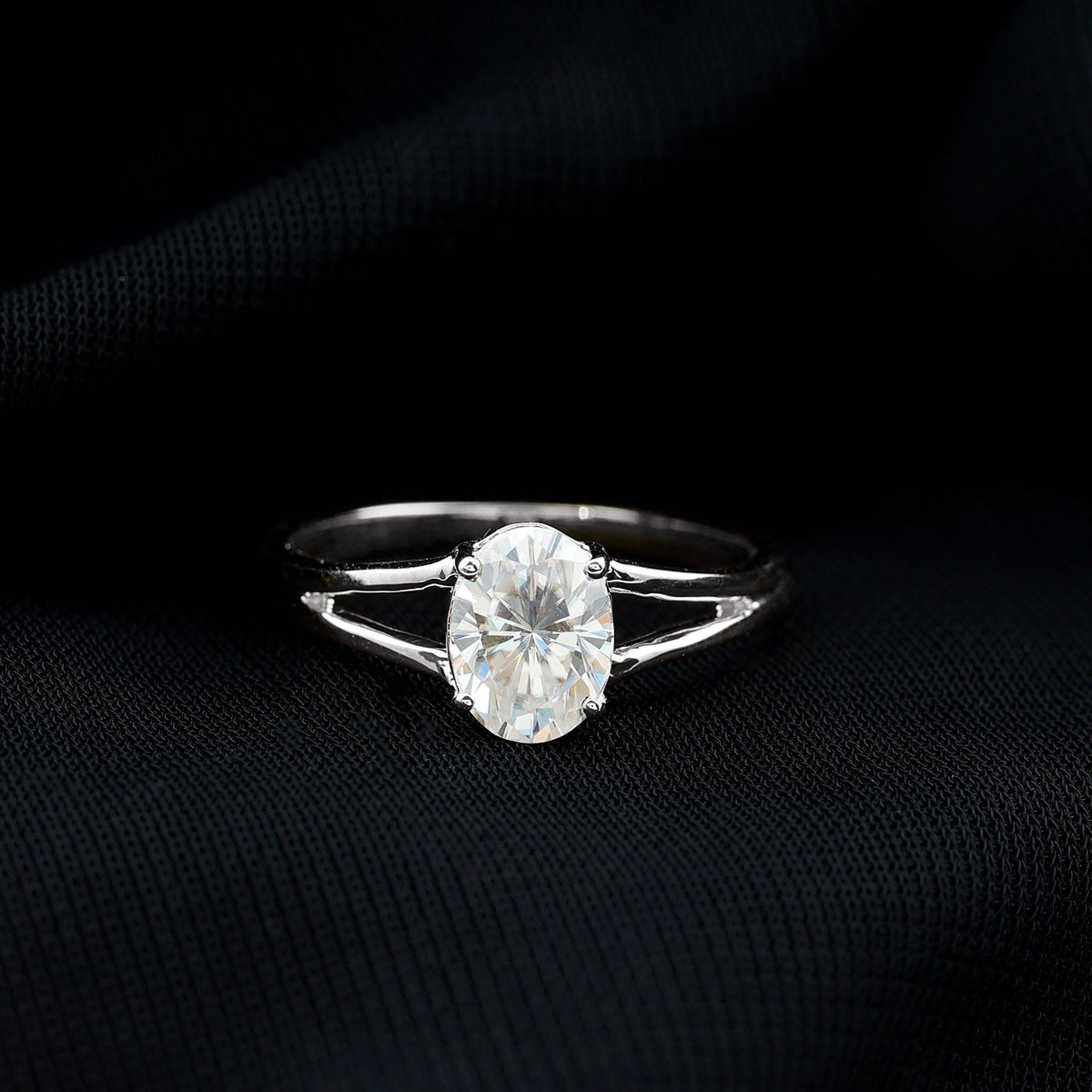 Elegant 1 Carat Oval Moissanite engagement ring from Rosec Jewels featuring a sparkling gemstone and a sleek band.