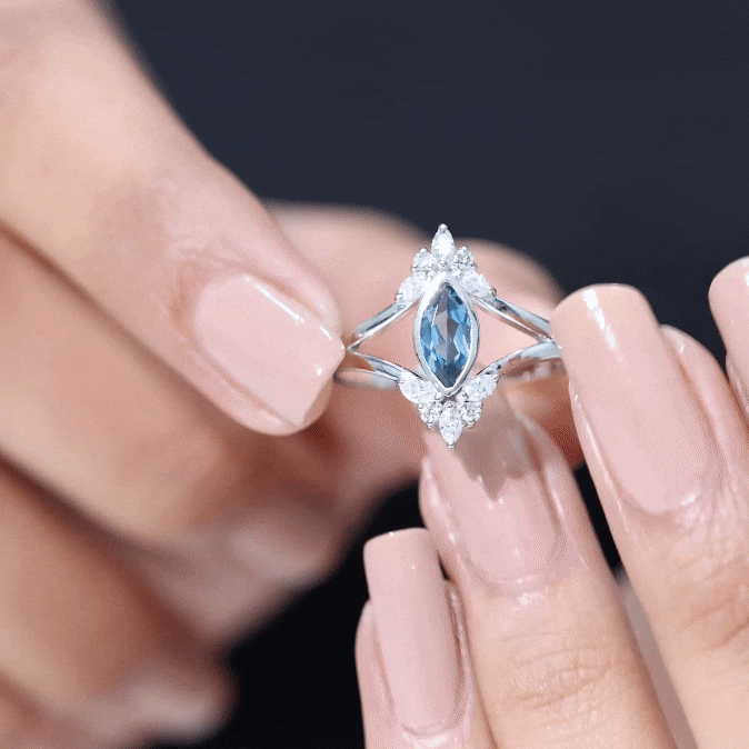 Marquise cut London Blue Topaz cocktail ring with diamonds by Rosec Jewels, showcasing a vibrant blue gemstone and sparkling accents.