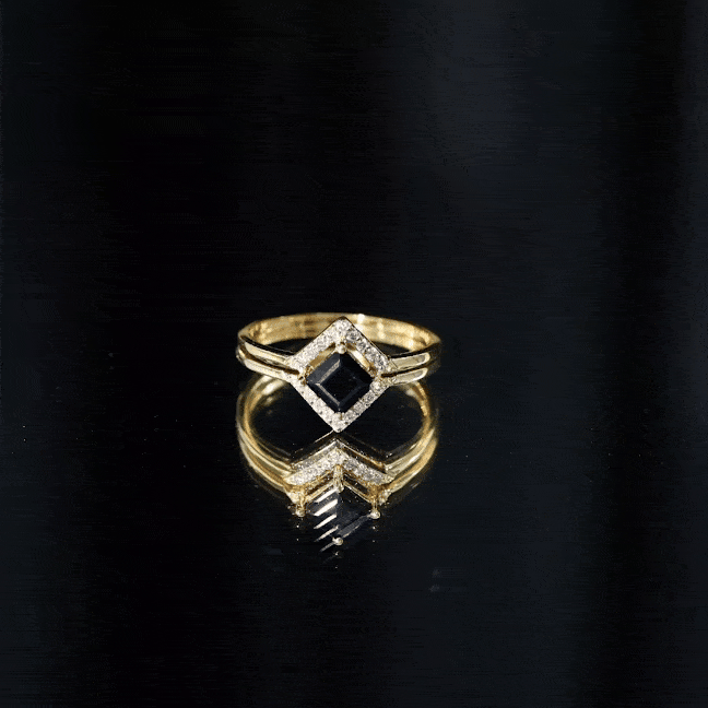 Real black onyx and diamond princess cut engagement ring with ring guard, featuring intricate band details and sparkling gemstones.