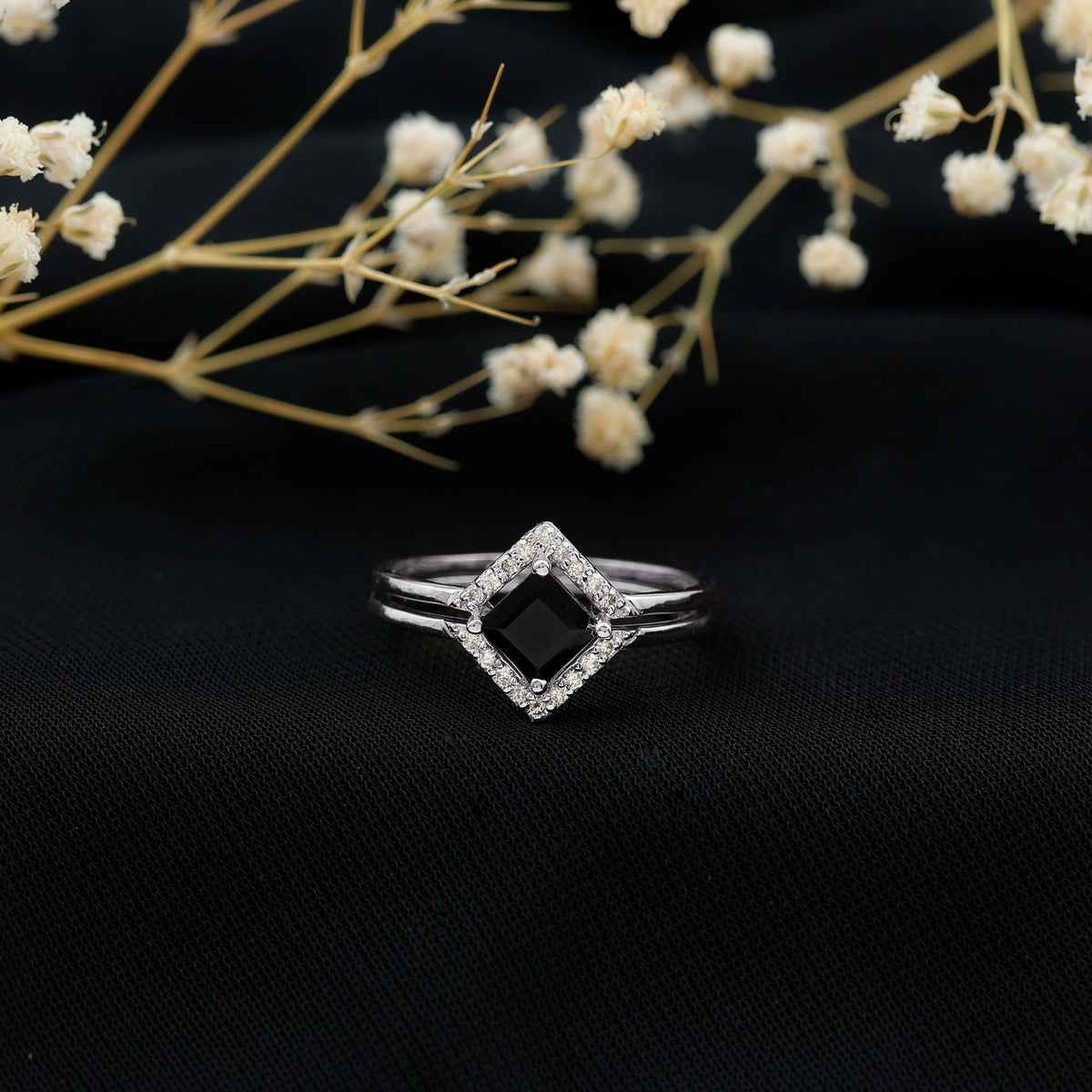 Real black onyx and diamond princess cut engagement ring with ring guard, featuring detailed metalwork and sparkling gemstones.
