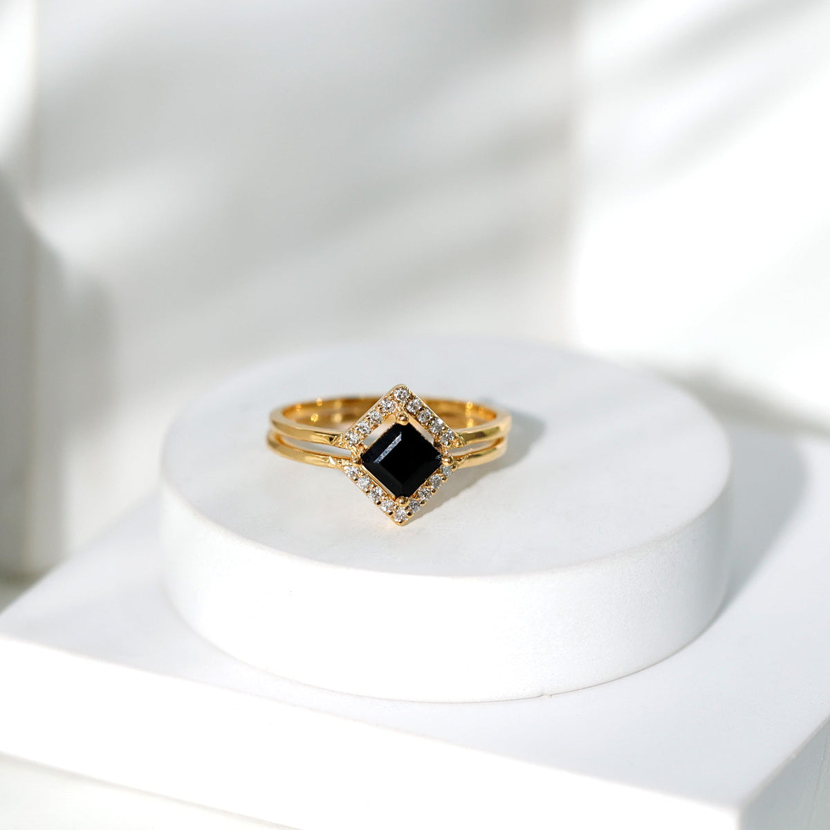 Elegant black onyx and diamond princess cut engagement ring with ring guard from Rosec Jewels, showcasing intricate design and sparkling stones.
