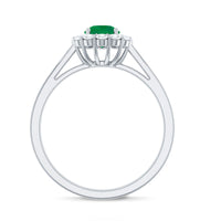 Round emerald and diamond engagement ring by Rosec Jewels featuring a classic design with a central emerald gemstone and sparkling diamonds.