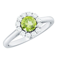Natural half carat Peridot engagement ring by Rosec Jewels with diamond halo and gold band, showcasing the vibrant green gemstone.